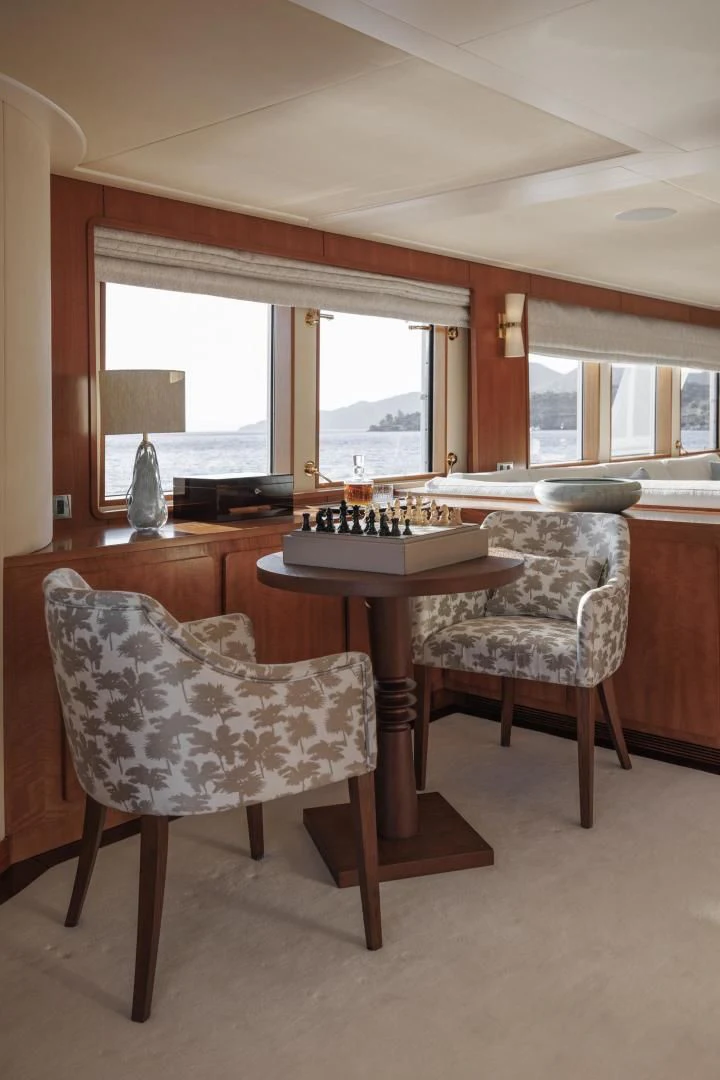 a kitchen with a table and chairs aboard SYNTHESIS 66 Yacht for Sale