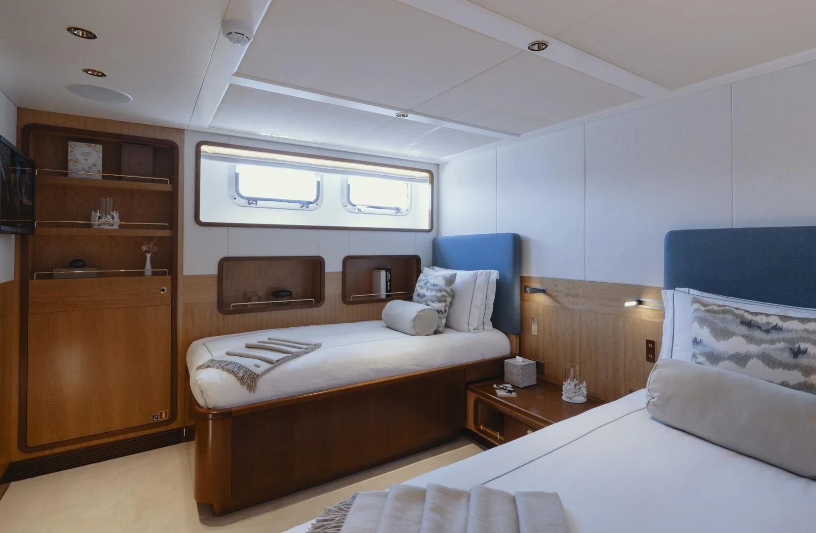 a room with two beds aboard SYNTHESIS 66 Yacht for Sale