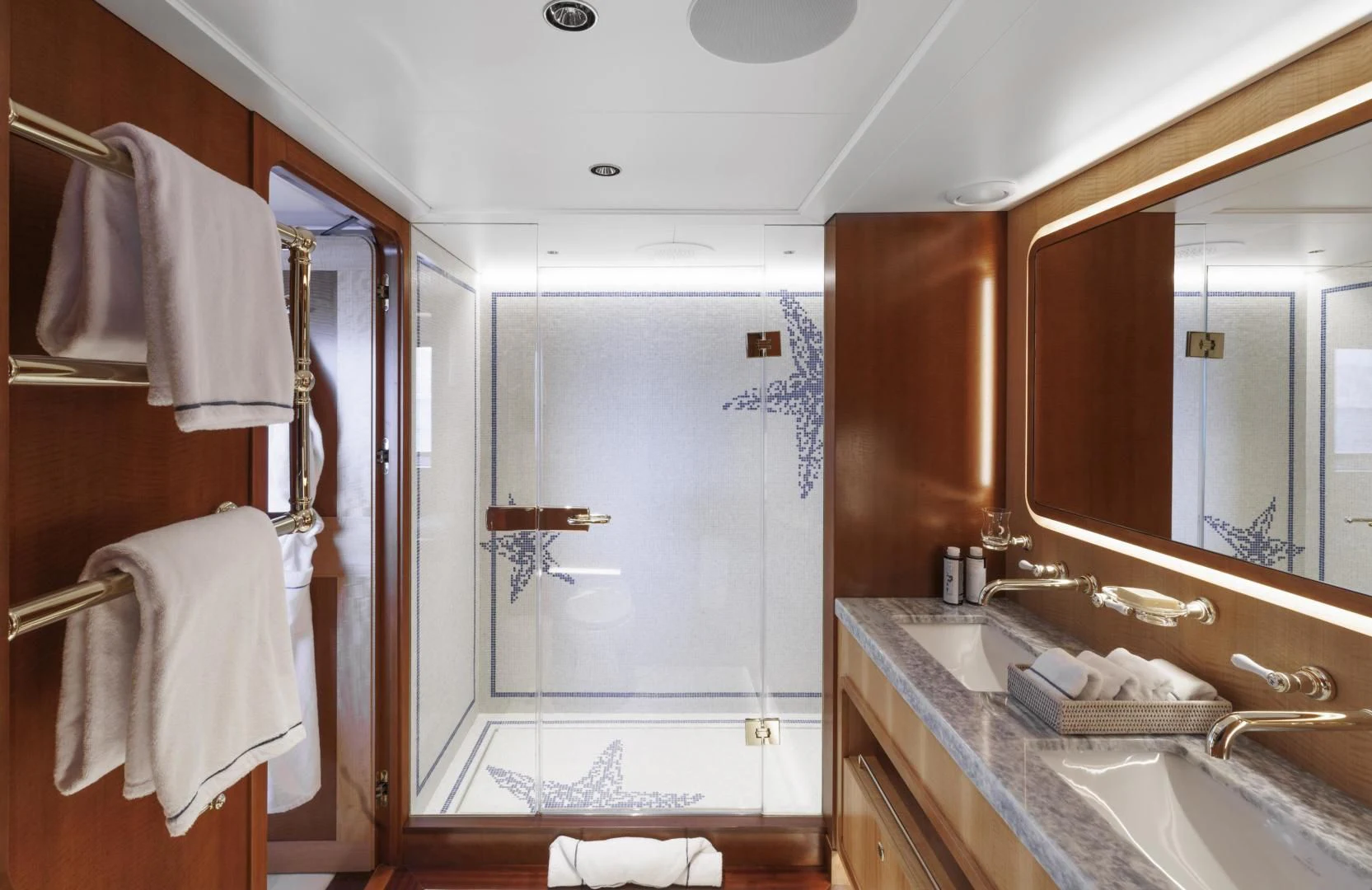 a bathroom with a sink and mirror aboard SYNTHESIS 66 Yacht for Sale