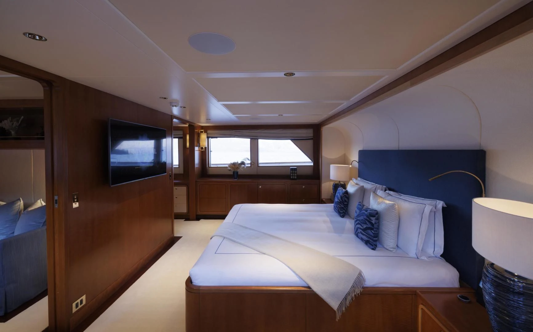a bedroom with a bed and a tv aboard SYNTHESIS 66 Yacht for Sale