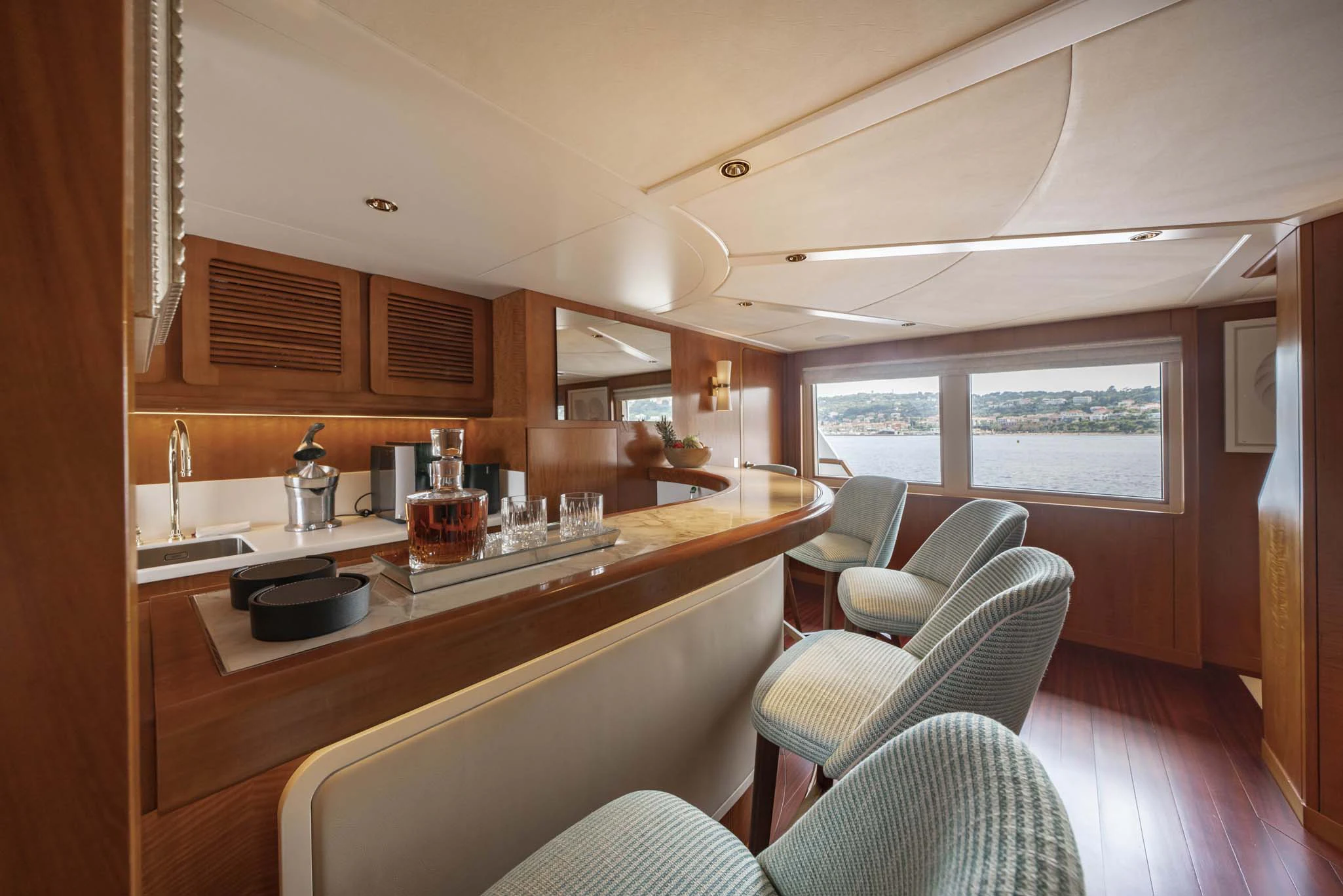 a kitchen with a table and chairs aboard SYNTHESIS 66 Yacht for Sale