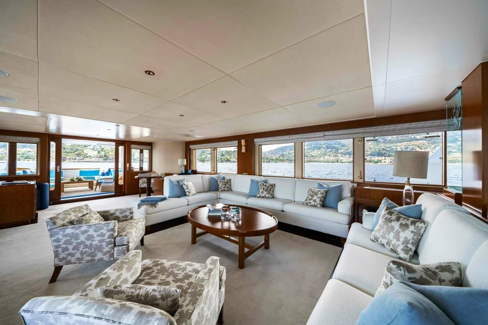 a living room with a large window aboard SYNTHESIS 66 Yacht for Sale