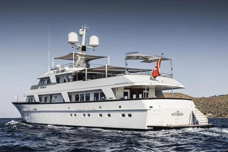 a large white ship in the water aboard SYNTHESIS 66 Yacht for Sale