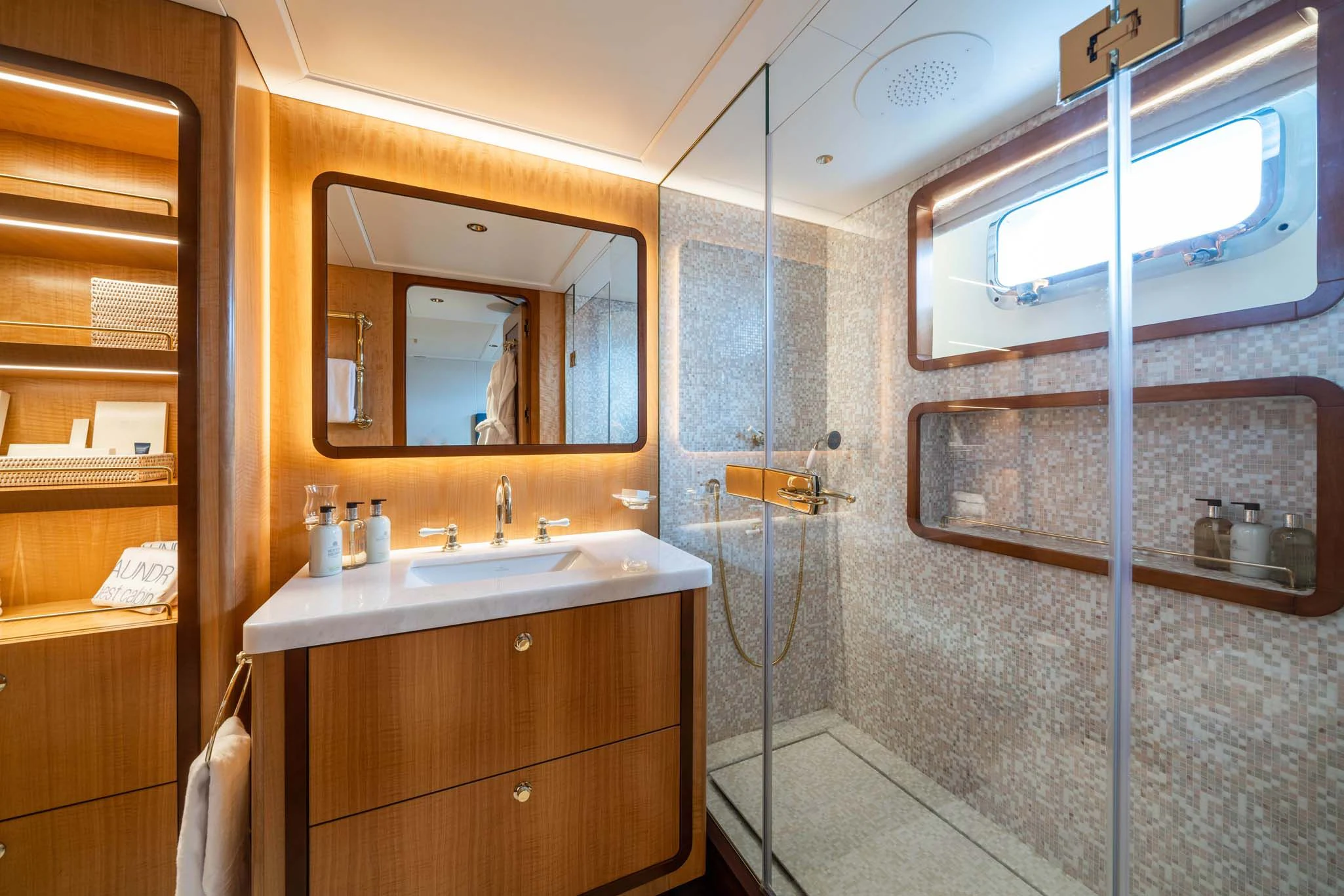 a bathroom with a sink and a mirror aboard SYNTHESIS 66 Yacht for Sale