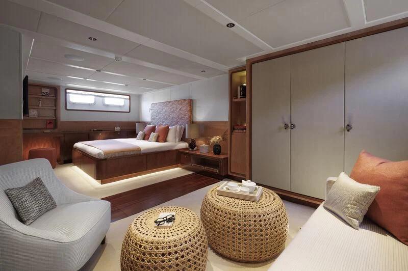 a living room with a couch and a table aboard SYNTHESIS 66 Yacht for Sale