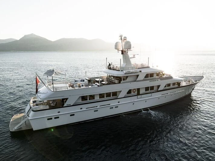 a large white ship in the water aboard SYNTHESIS 66 Yacht for Sale