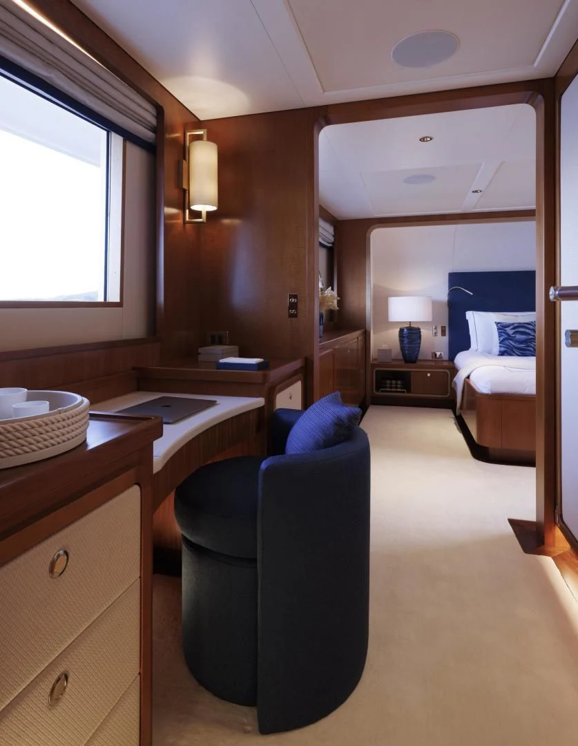 a room with a desk and a chair aboard SYNTHESIS 66 Yacht for Sale
