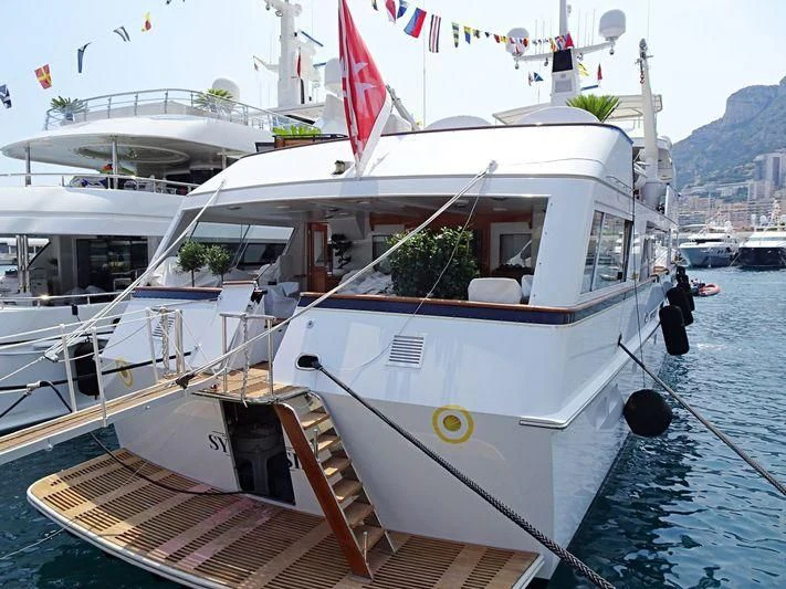 a boat docked at a pier aboard SYNTHESIS 66 Yacht for Sale