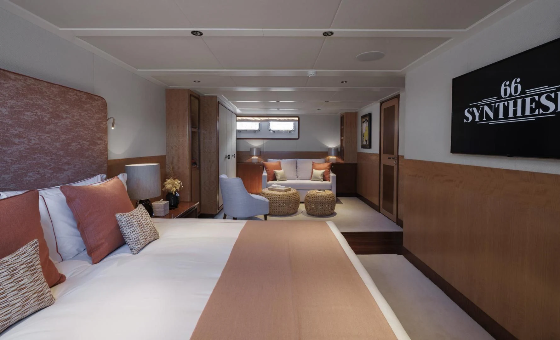 a large hotel room with a large bed and a large screen aboard SYNTHESIS 66 Yacht for Sale