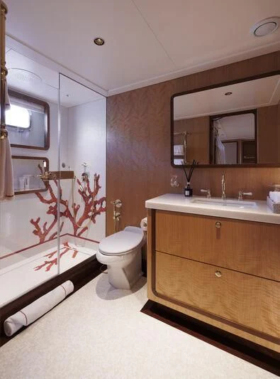 a bathroom with a toilet and sink aboard SYNTHESIS 66 Yacht for Sale