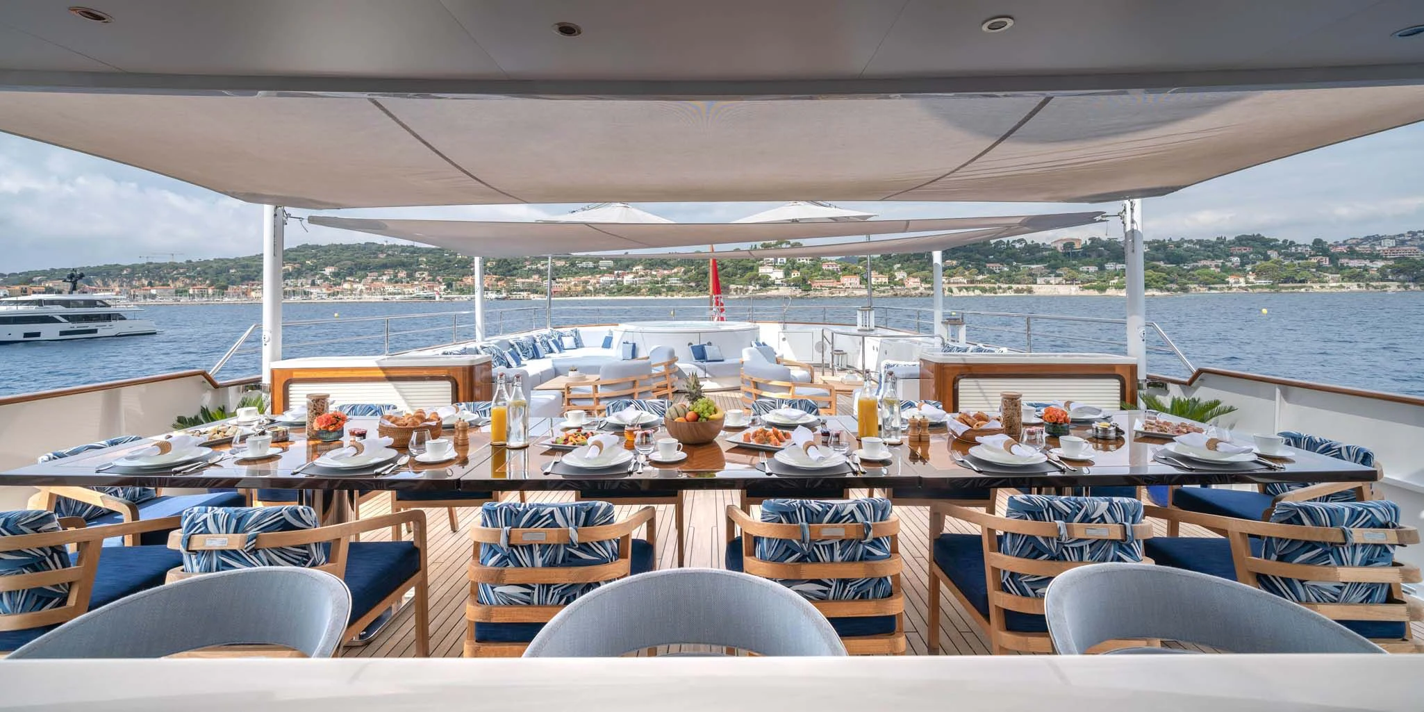 a table set for a meal on a boat aboard SYNTHESIS 66 Yacht for Sale