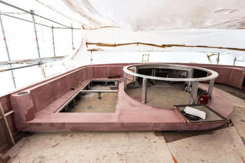 a large room with a bed and a laptop aboard SYNTHESIS 66 Yacht for Sale