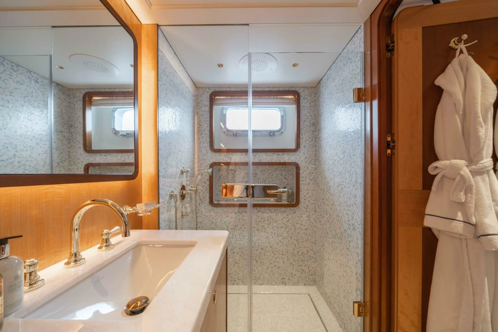 a bathroom with a sink and a mirror aboard SYNTHESIS 66 Yacht for Sale