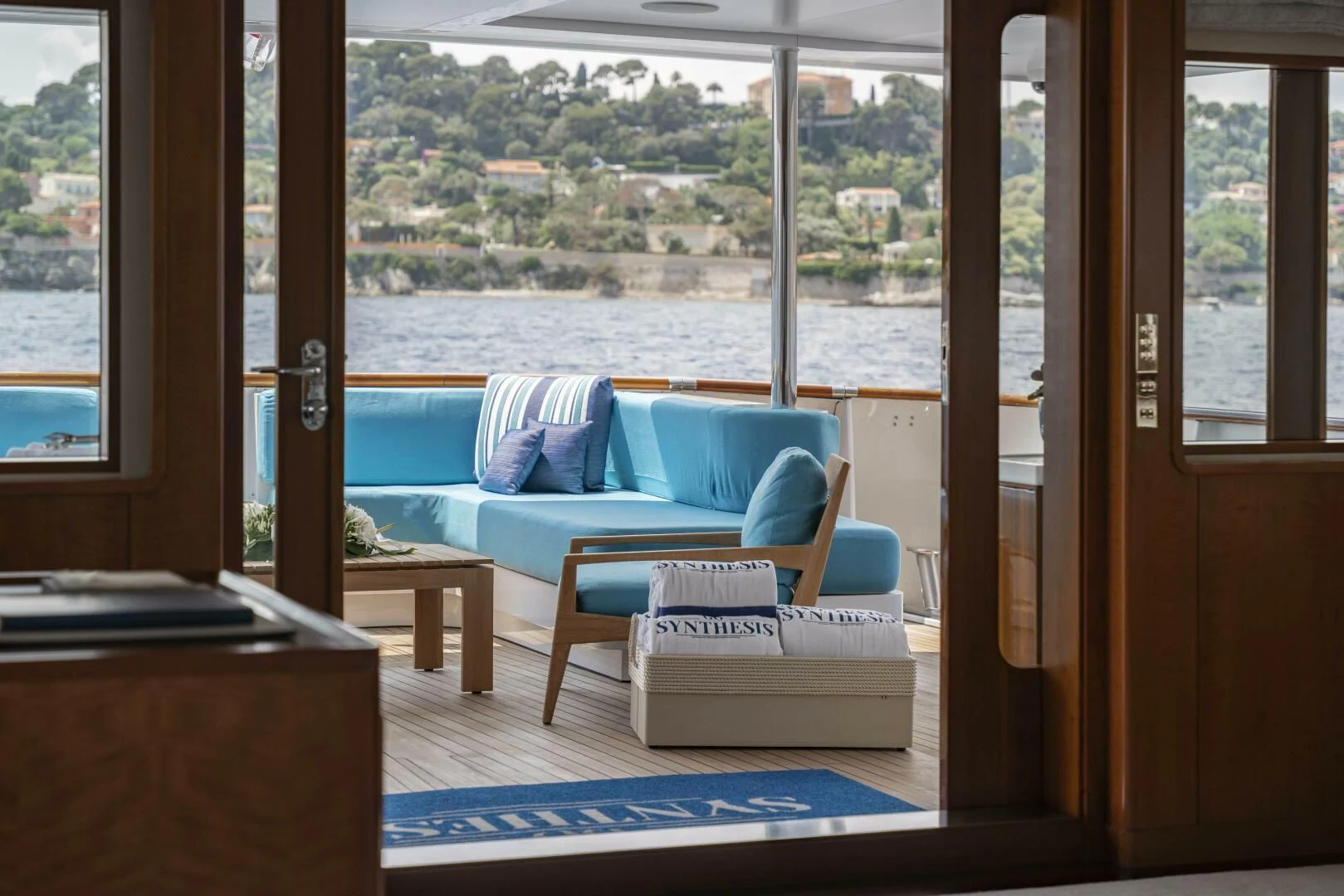 a room with a couch and a table aboard SYNTHESIS 66 Yacht for Sale