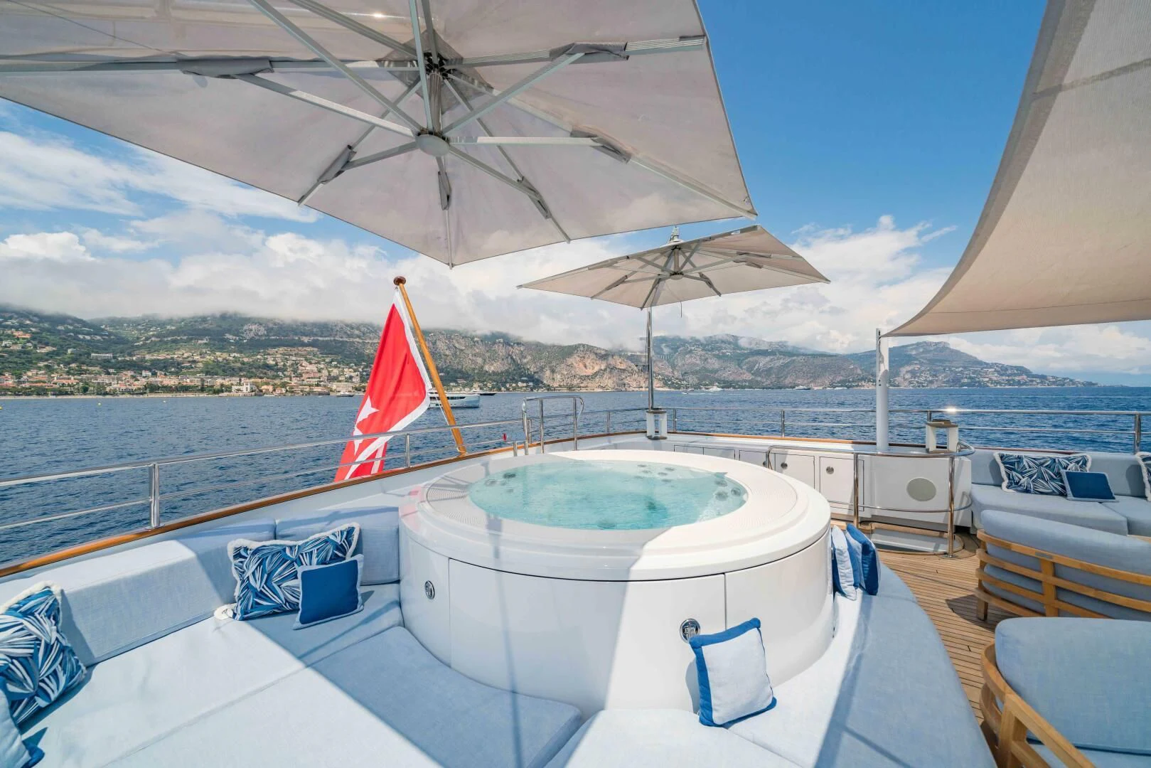 a pool with a large umbrella aboard SYNTHESIS 66 Yacht for Sale
