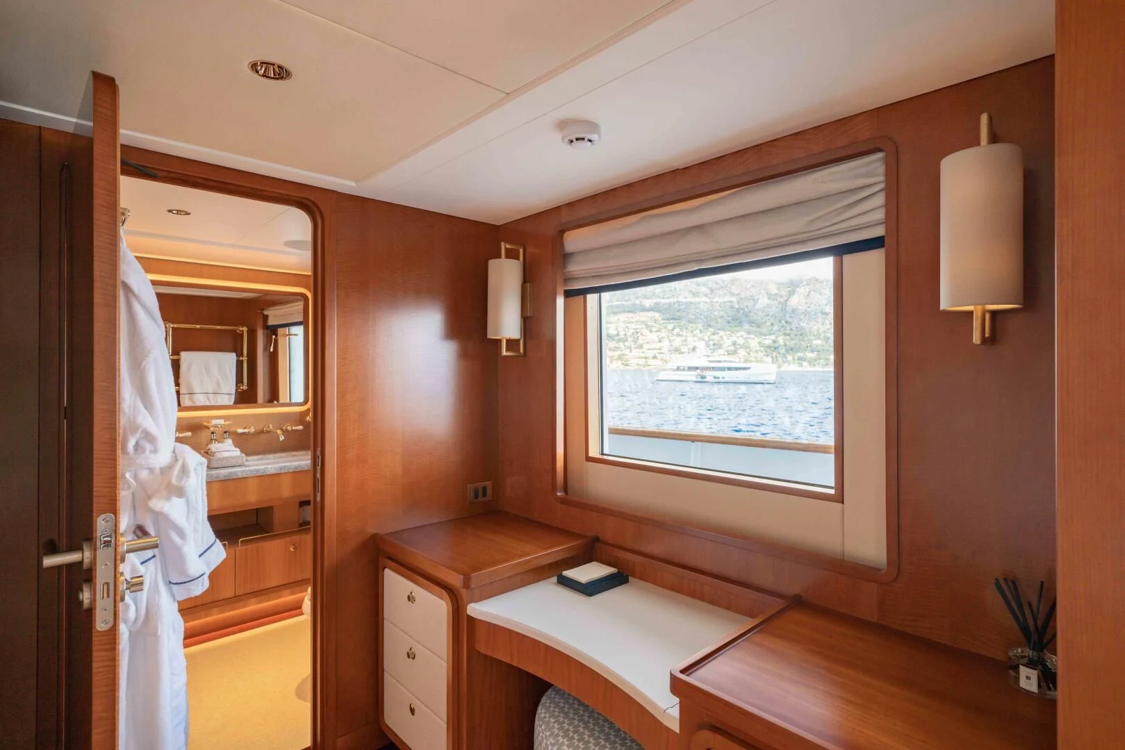 a room with a bed and a window aboard SYNTHESIS 66 Yacht for Sale