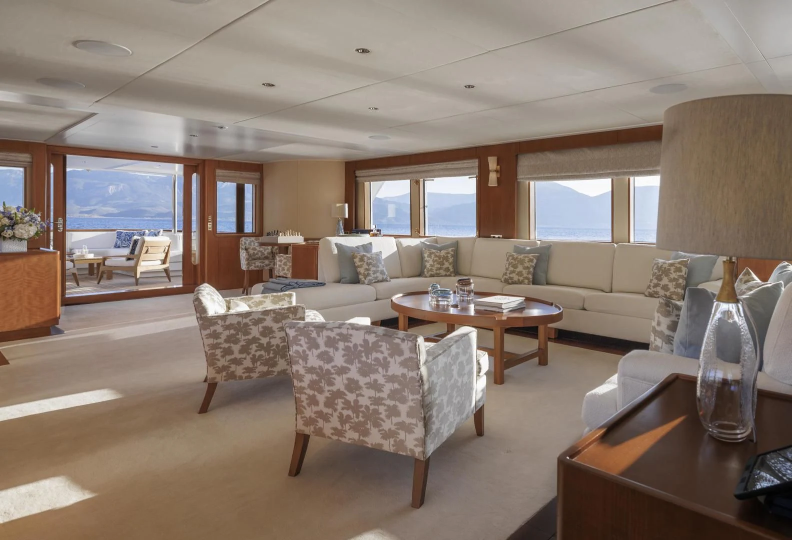 a living room with a large window aboard SYNTHESIS 66 Yacht for Sale