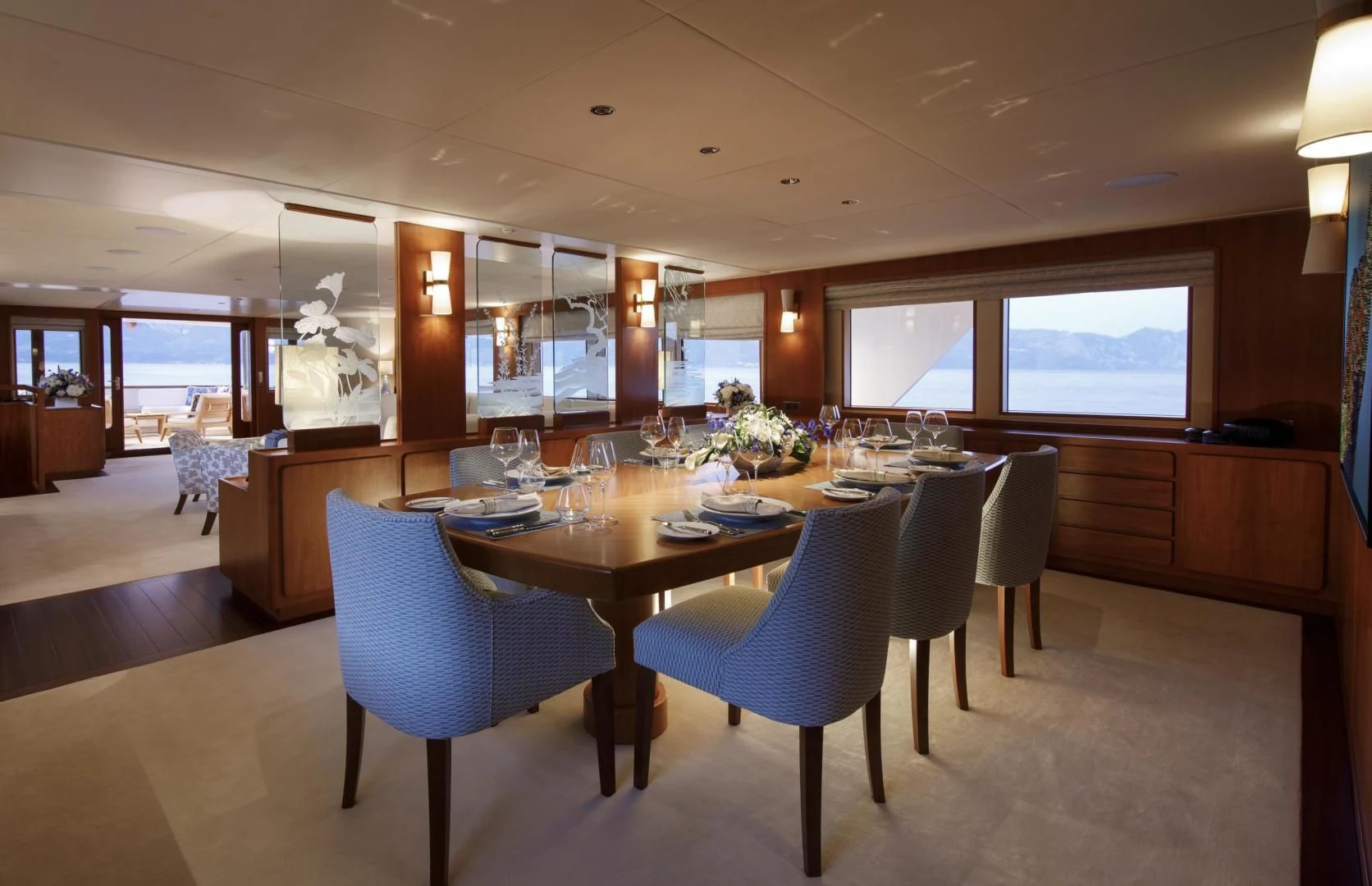 a large dining room with a large table and chairs aboard SYNTHESIS 66 Yacht for Sale