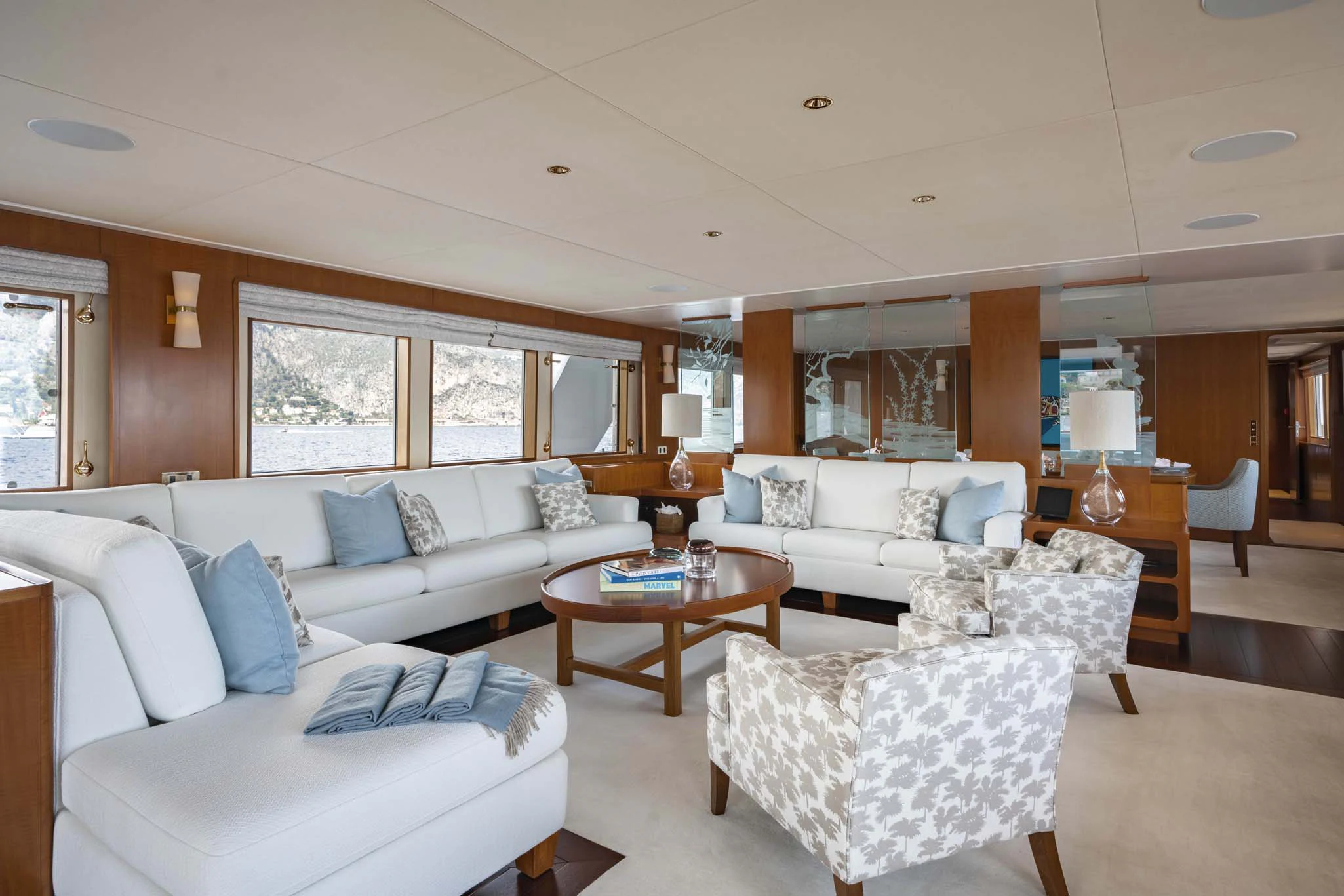 a living room with a couch and a table aboard SYNTHESIS 66 Yacht for Sale