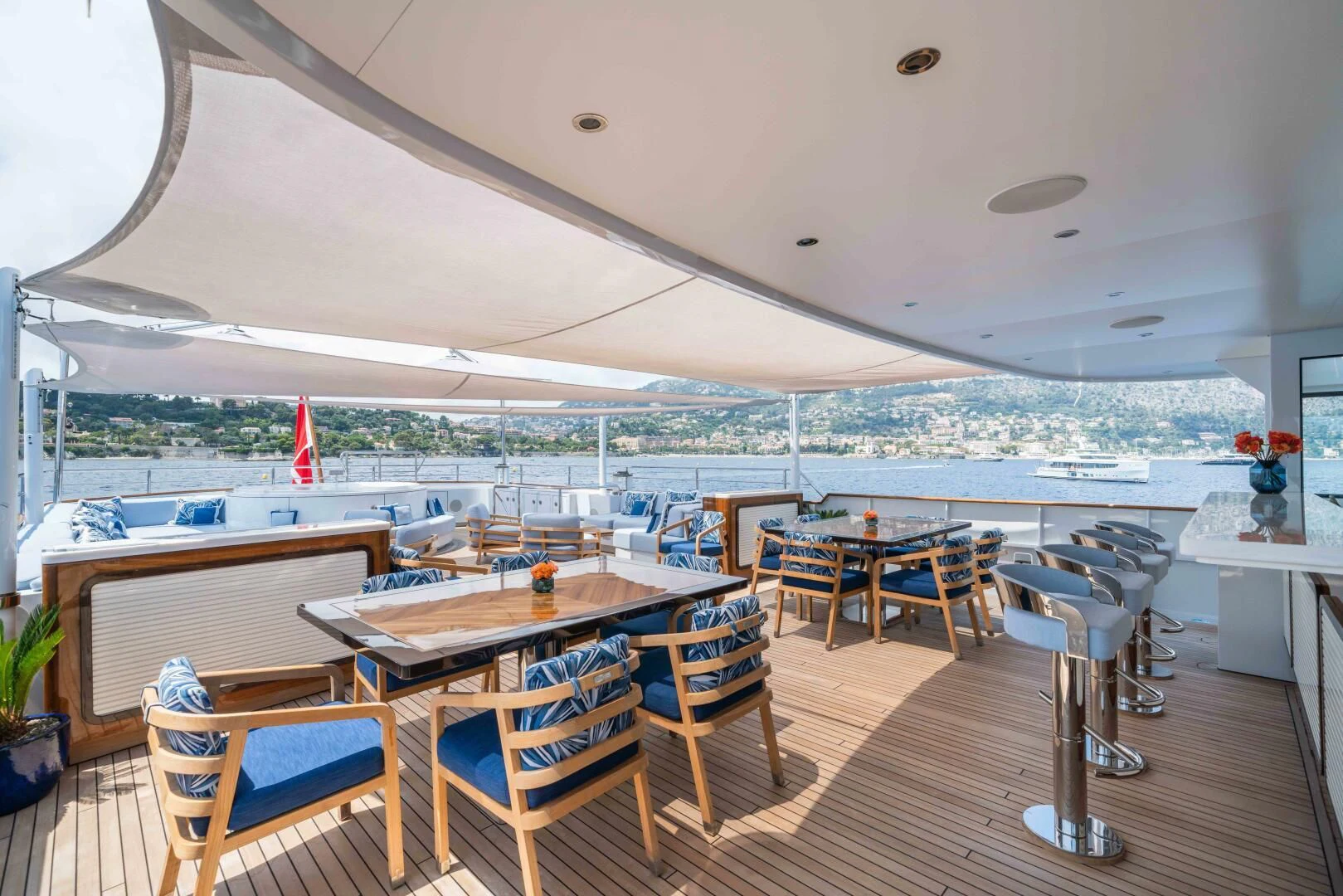 a room with tables and chairs aboard SYNTHESIS 66 Yacht for Sale