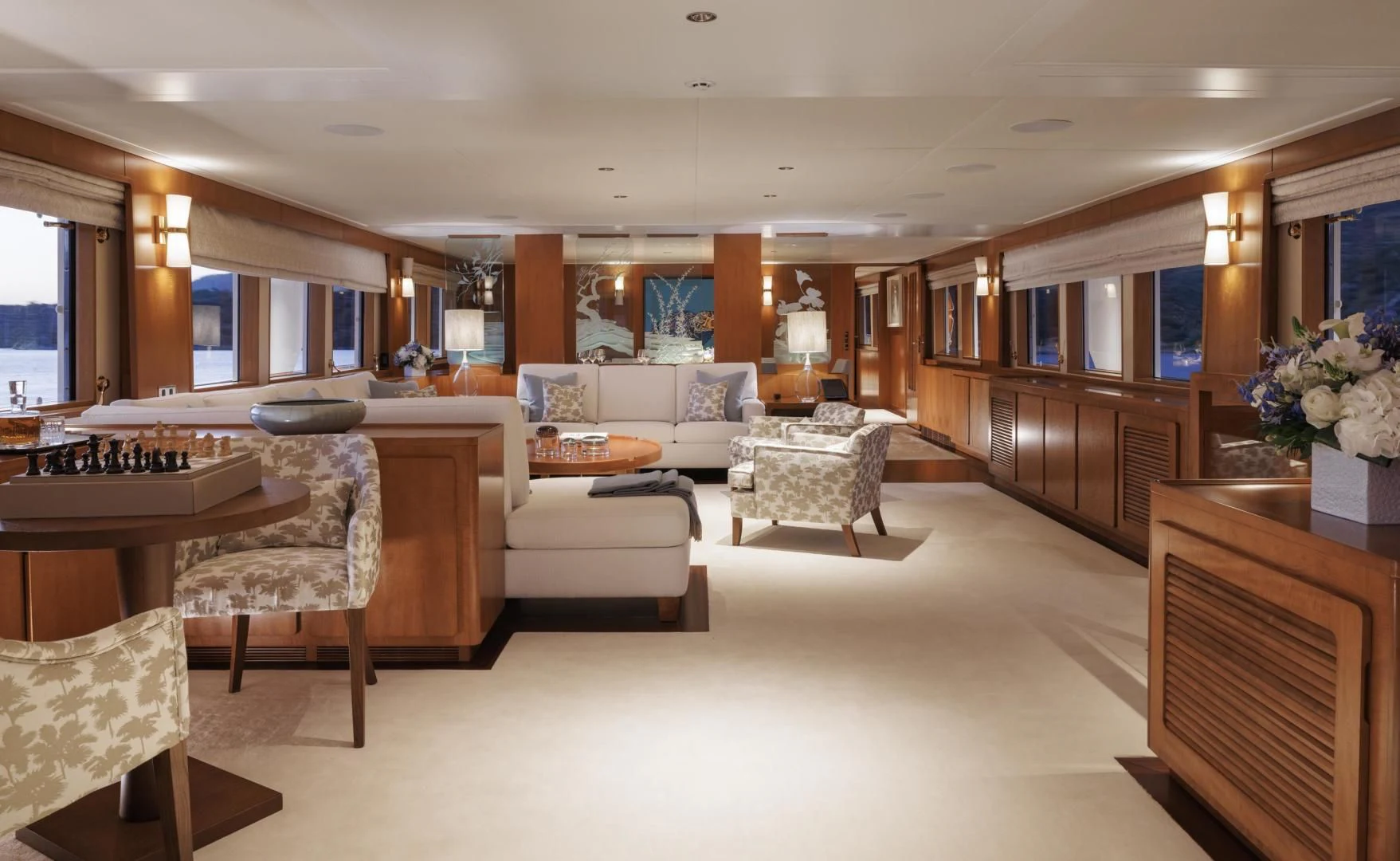 a living room with a kitchen and dining area aboard SYNTHESIS 66 Yacht for Sale