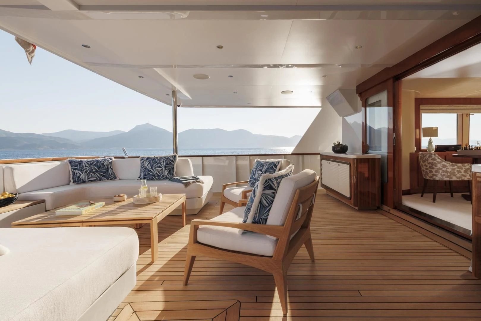 a living room with a large window aboard SYNTHESIS 66 Yacht for Sale