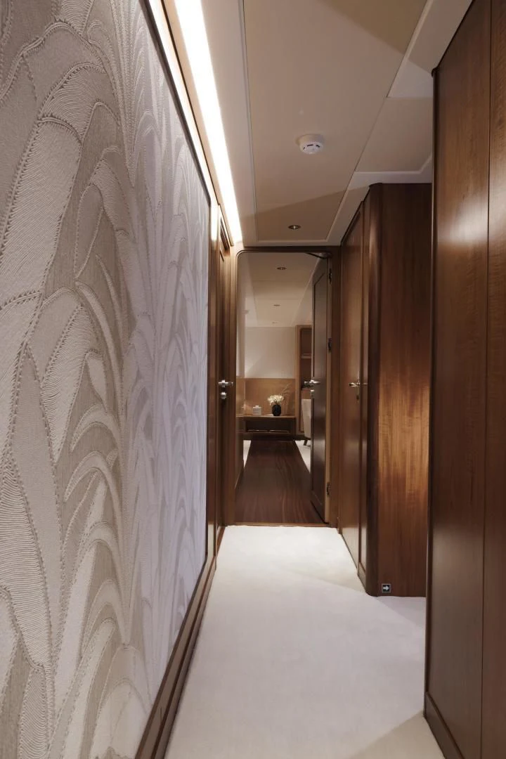 a hallway with a row of doors aboard SYNTHESIS 66 Yacht for Sale