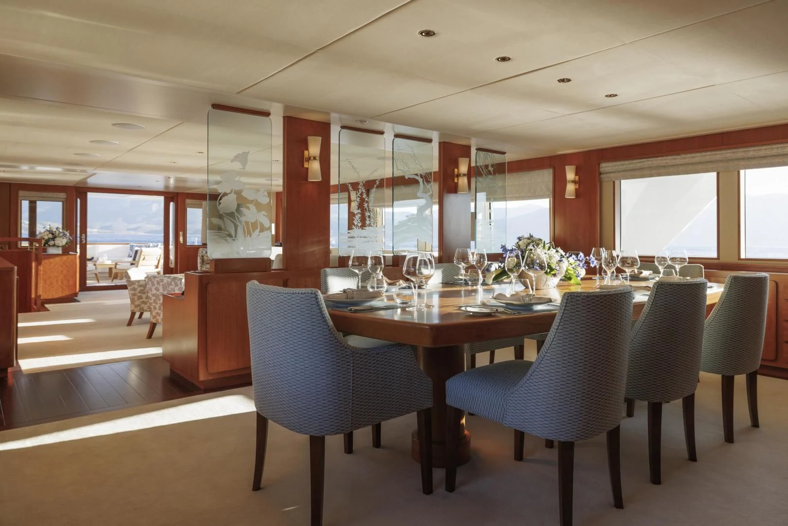 a large dining room with a table and chairs aboard SYNTHESIS 66 Yacht for Sale