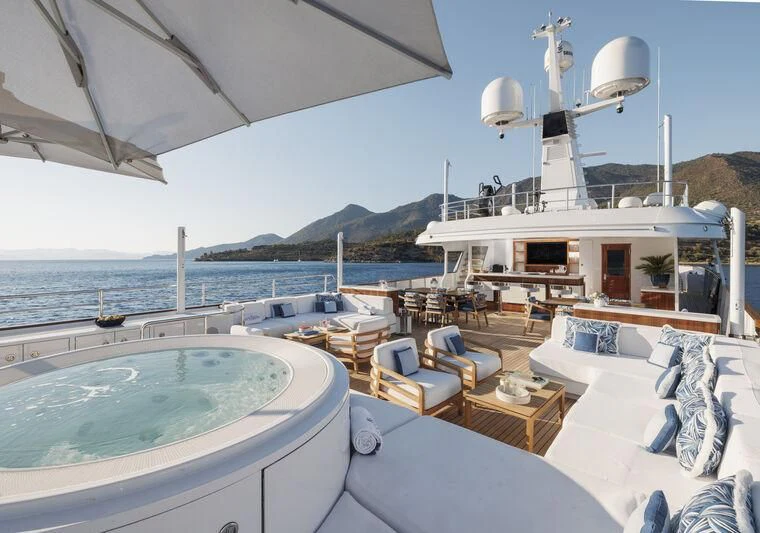 a large white boat in a large body of water aboard SYNTHESIS 66 Yacht for Sale