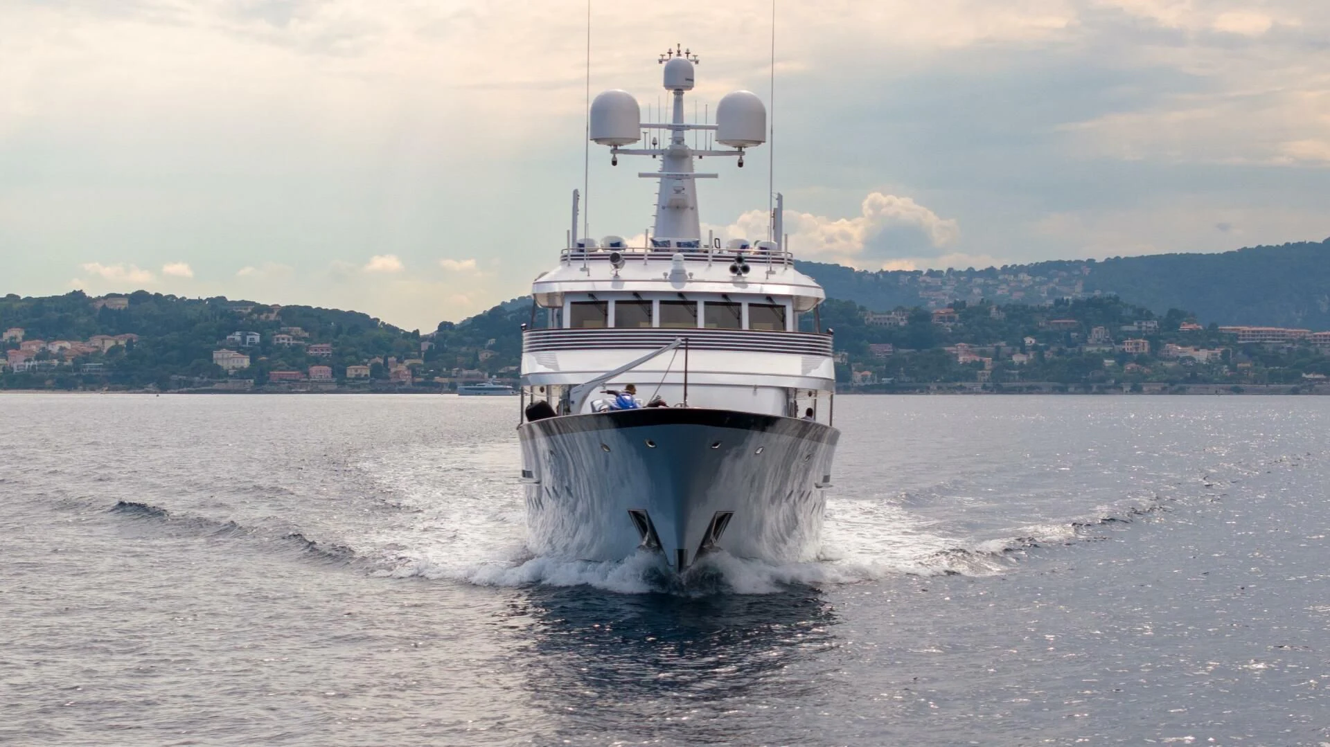 a large ship in the water aboard SYNTHESIS 66 Yacht for Sale