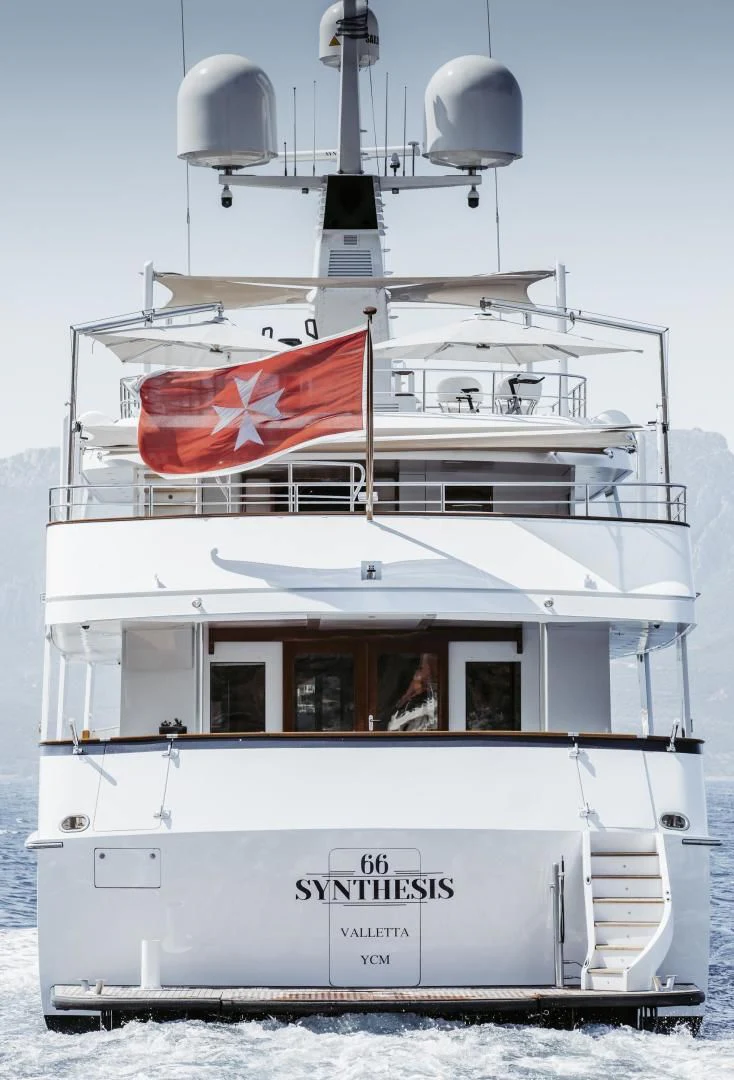 a large white ship with a flag on top aboard SYNTHESIS 66 Yacht for Sale
