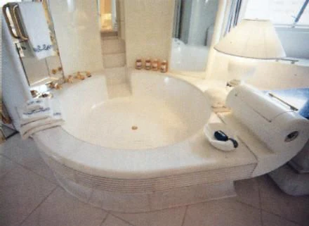 a bathtub with a toilet aboard KINGDOM 5KR Yacht for Sale