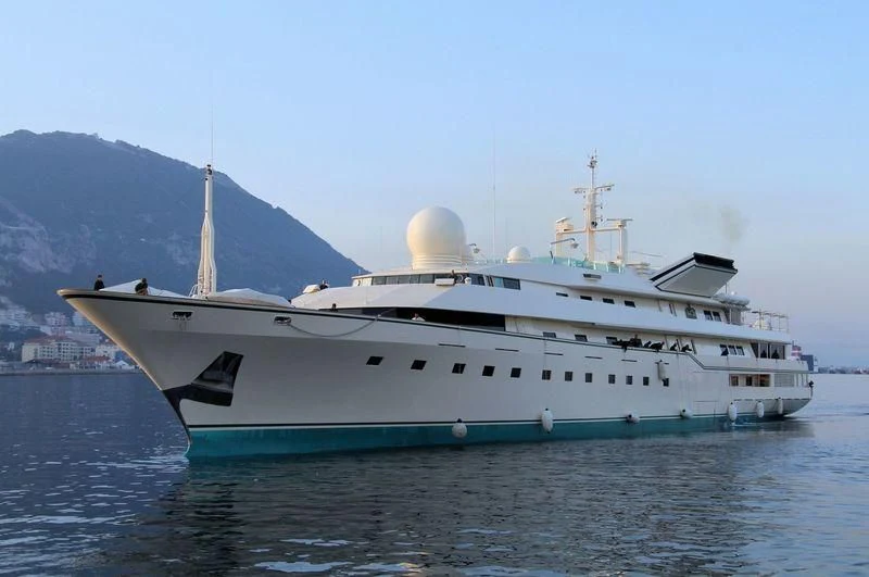 a large white ship in the water aboard KINGDOM 5KR Yacht for Sale