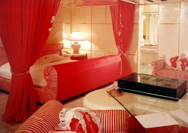a room with a bed and a table aboard KINGDOM 5KR Yacht for Sale