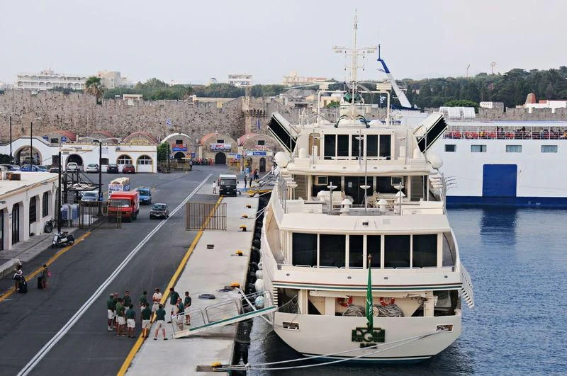 a boat is parked on the side of the road aboard KINGDOM 5KR Yacht for Sale