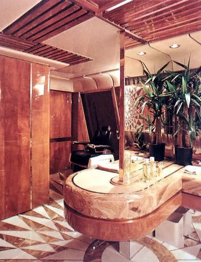 a room with a table and plants aboard KINGDOM 5KR Yacht for Sale