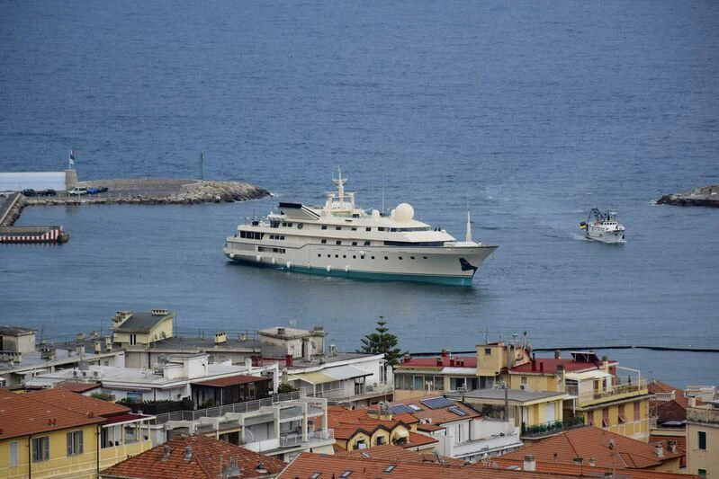 a large ship in the water aboard KINGDOM 5KR Yacht for Sale