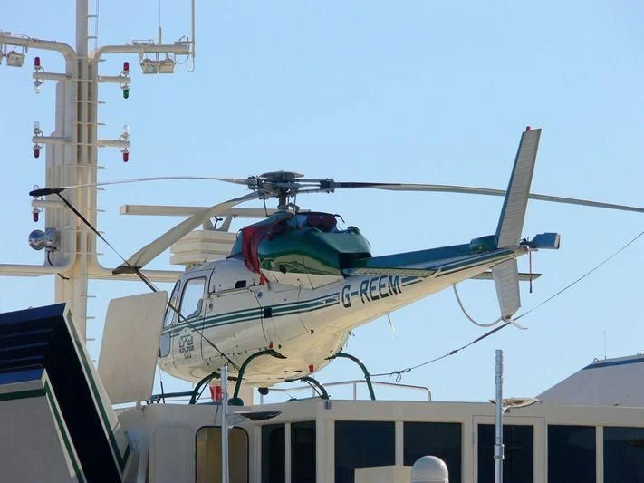 a helicopter on a roof aboard KINGDOM 5KR Yacht for Sale