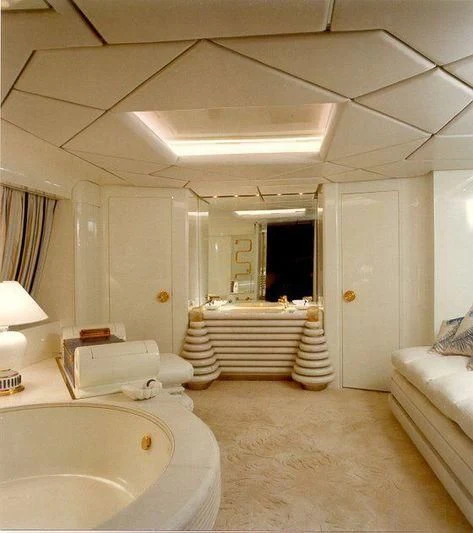 a bathroom with a tub and a bed aboard KINGDOM 5KR Yacht for Sale
