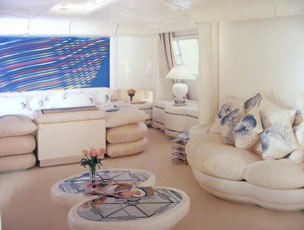 a living room with a large blue and white striped curtain aboard KINGDOM 5KR Yacht for Sale
