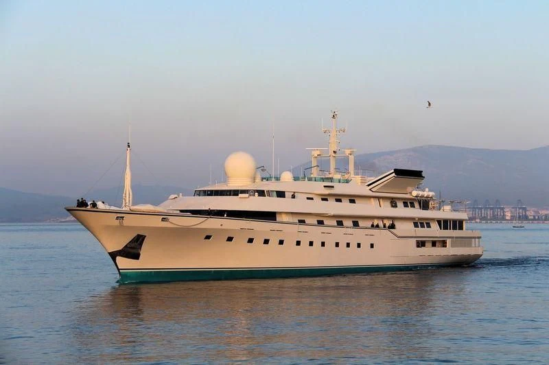 a large white ship in the water aboard KINGDOM 5KR Yacht for Sale
