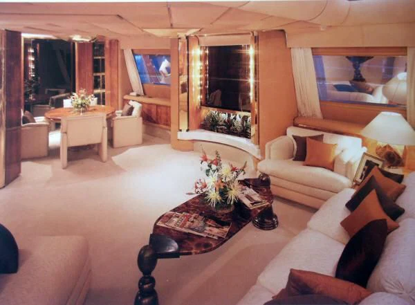 a living room with a large mirror aboard KINGDOM 5KR Yacht for Sale