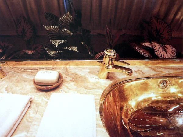 a couple of gold and silver candles on a counter aboard KINGDOM 5KR Yacht for Sale