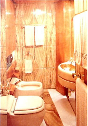 a bathroom with a toilet and sink aboard KINGDOM 5KR Yacht for Sale