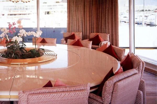a table with a plate of food on it aboard KINGDOM 5KR Yacht for Sale