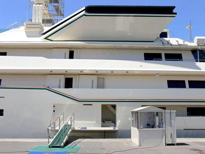 a white building with a staircase aboard KINGDOM 5KR Yacht for Sale