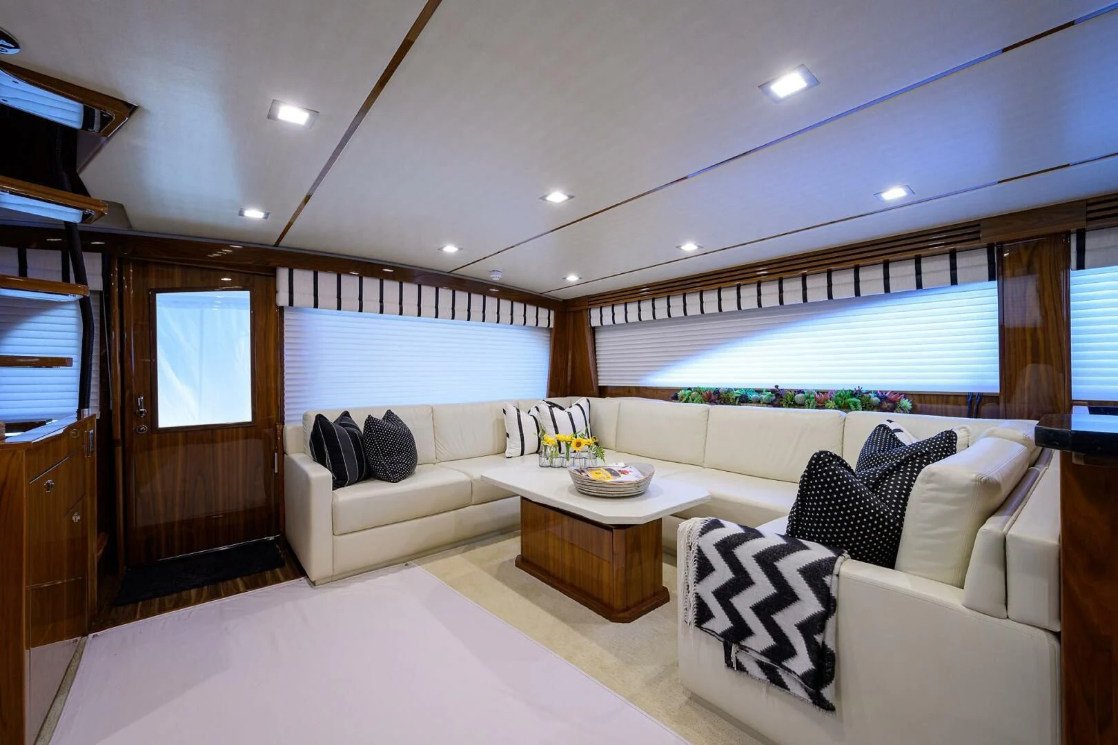 a living room with a large window aboard 80' VIKING Yacht for Sale