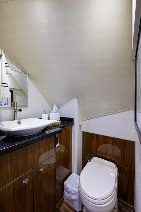a bathroom with a sink and a toilet aboard 80' VIKING Yacht for Sale