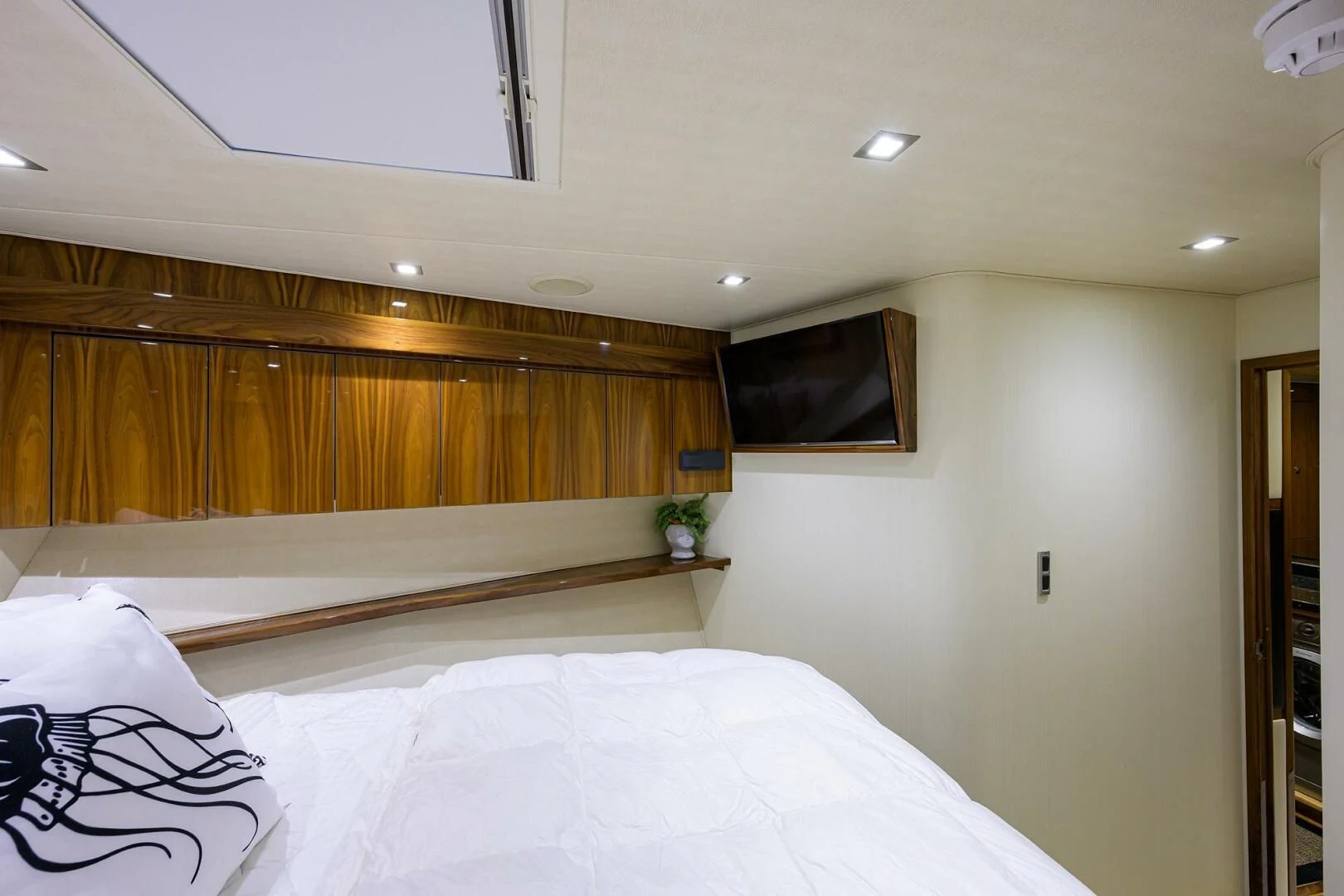 a bed with white sheets aboard 80' VIKING Yacht for Sale