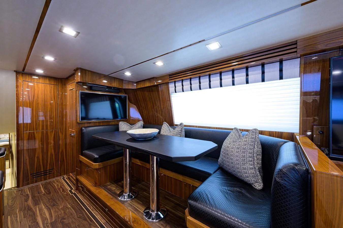 a living room with a couch and a table aboard 80' VIKING Yacht for Sale